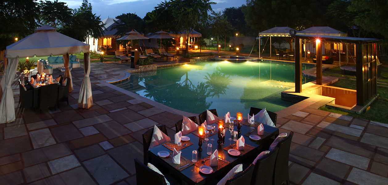 Dining by the poolside at the greenhouse resort